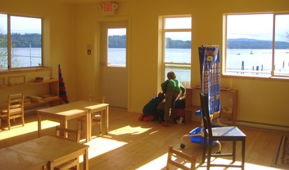 a fishing boat go by on the first day of classes in the new schoolhouse.